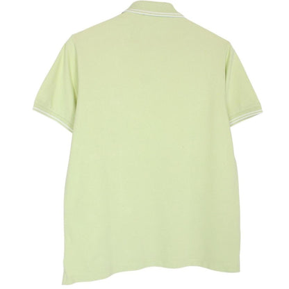 Stone Island green polo shirt with compass logo, cotton material, short sleeves.