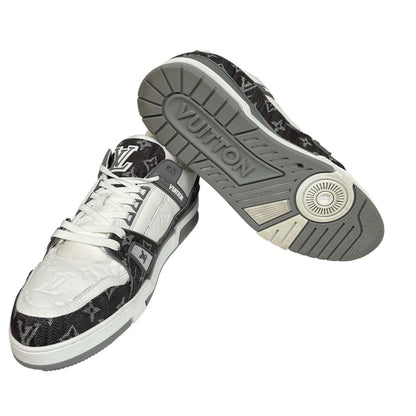 Louis Vuitton grey and white trainers with monogram pattern and leather accents.