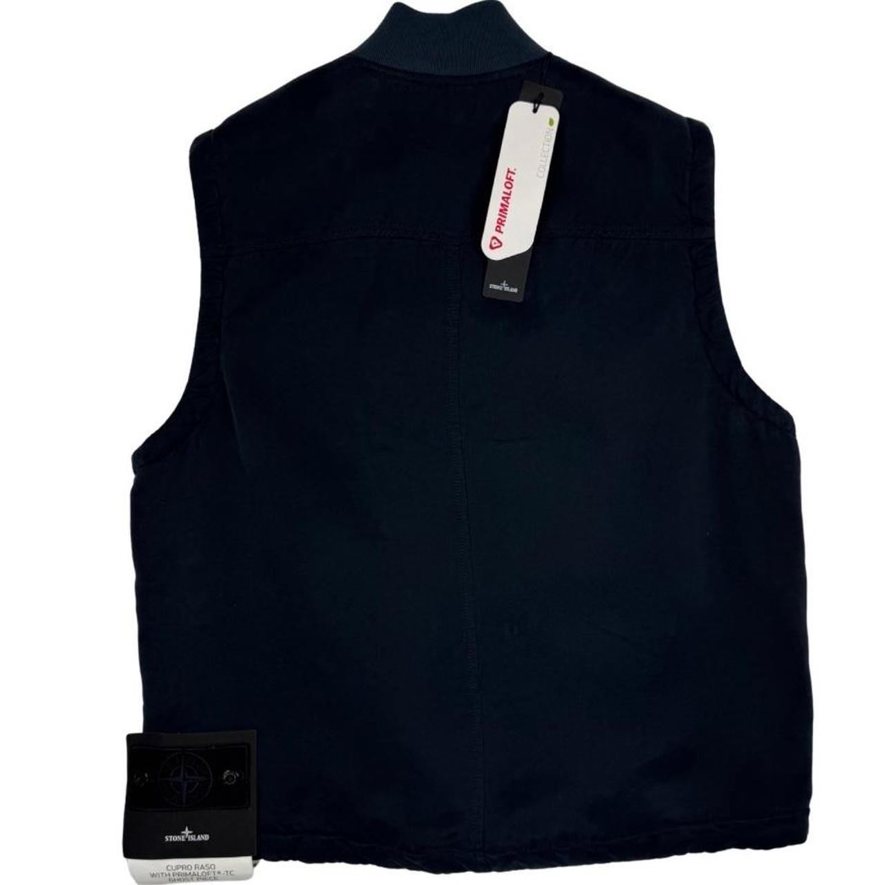 Stone Island navy blue vest jacket with logo patch and Primaloft material.