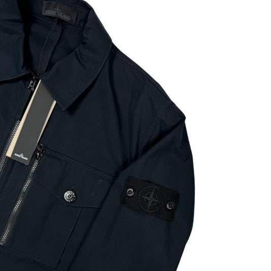 Stone Island navy blue waterproof overshirt jacket with ghost logo and cotton material.