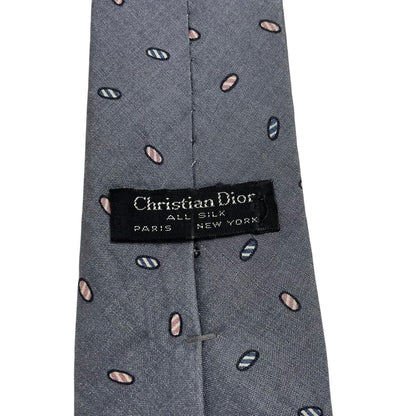 Christian Dior grey silk tie with abstract print and logo detail.