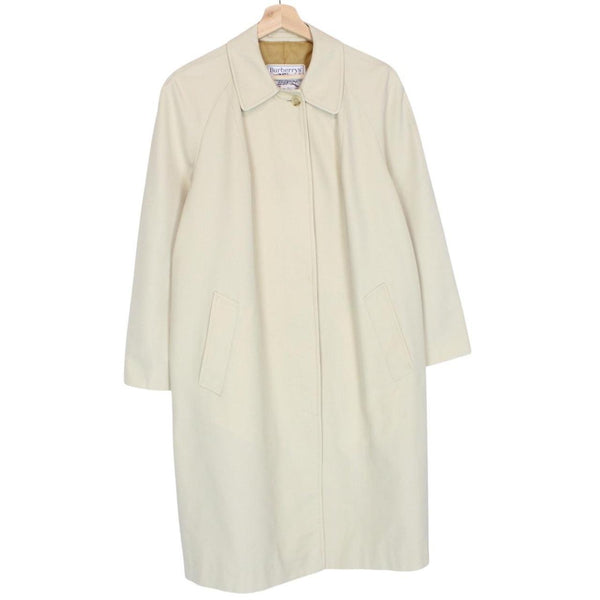 Burberry cream trench coat, single breasted, vintage 80s style, visible mark on sleeve.