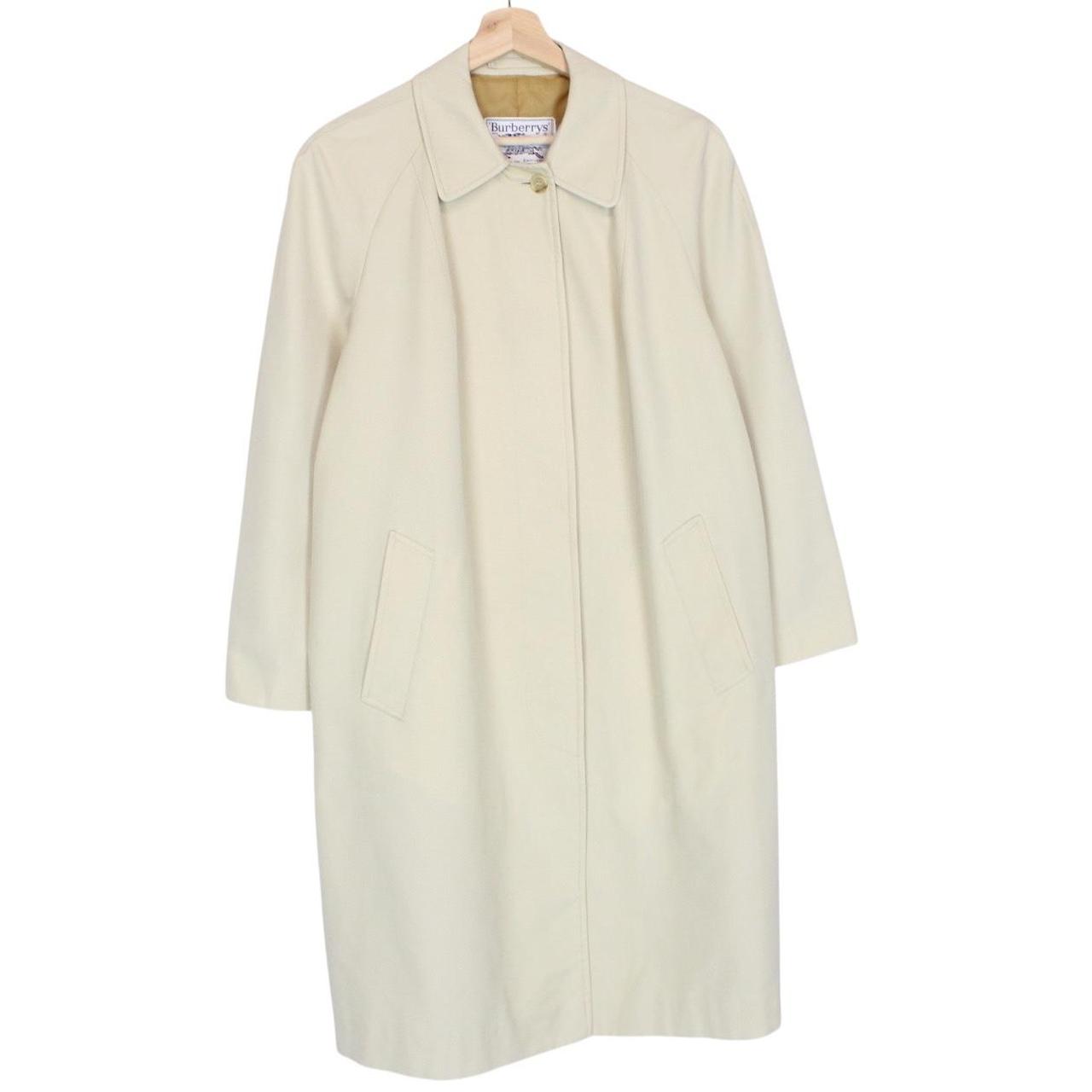 Burberry cream trench coat, single breasted, vintage 80s style, visible mark on sleeve.