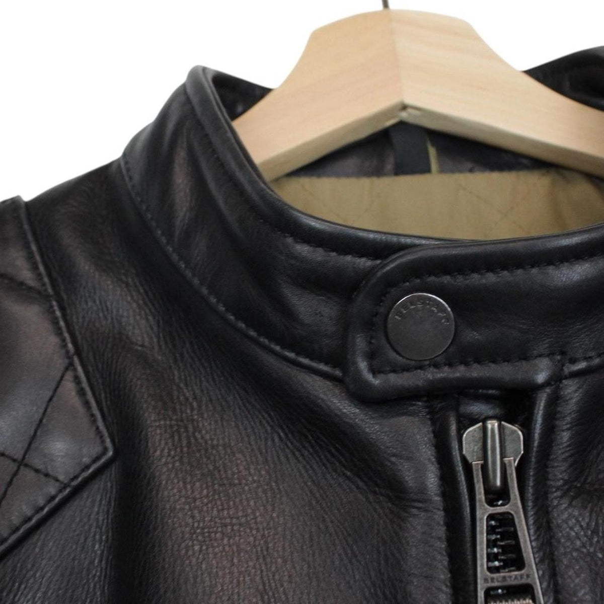 Belstaff black leather jacket with full zip and classic logo detailing.