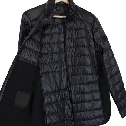 Moncler black lightweight down jacket with full zip and logo patch on sleeve.