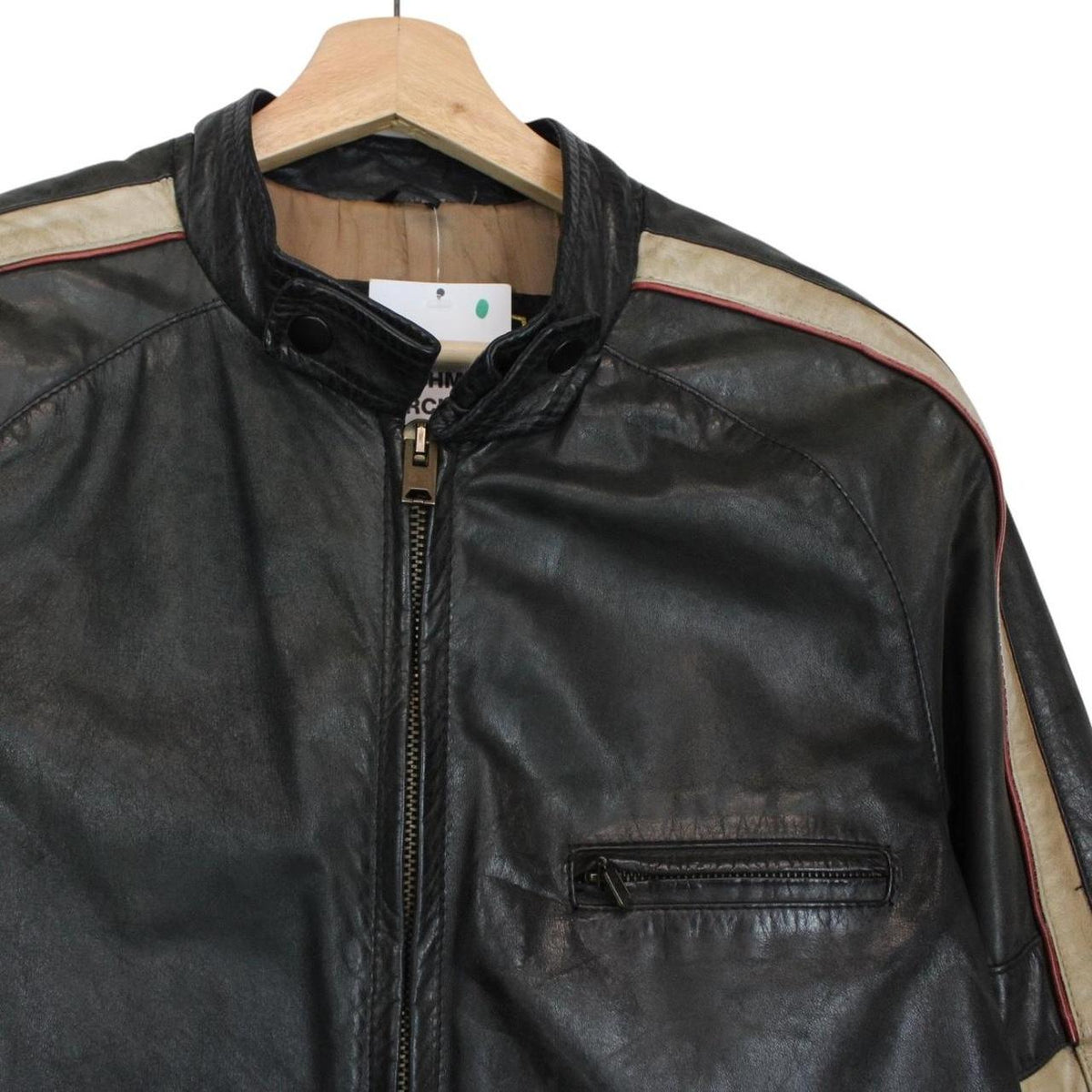 Belstaff beige and black leather jacket with vintage logo and cream detailing.