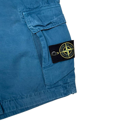 Stone Island teal blue cargo shorts with logo patch and cotton material.