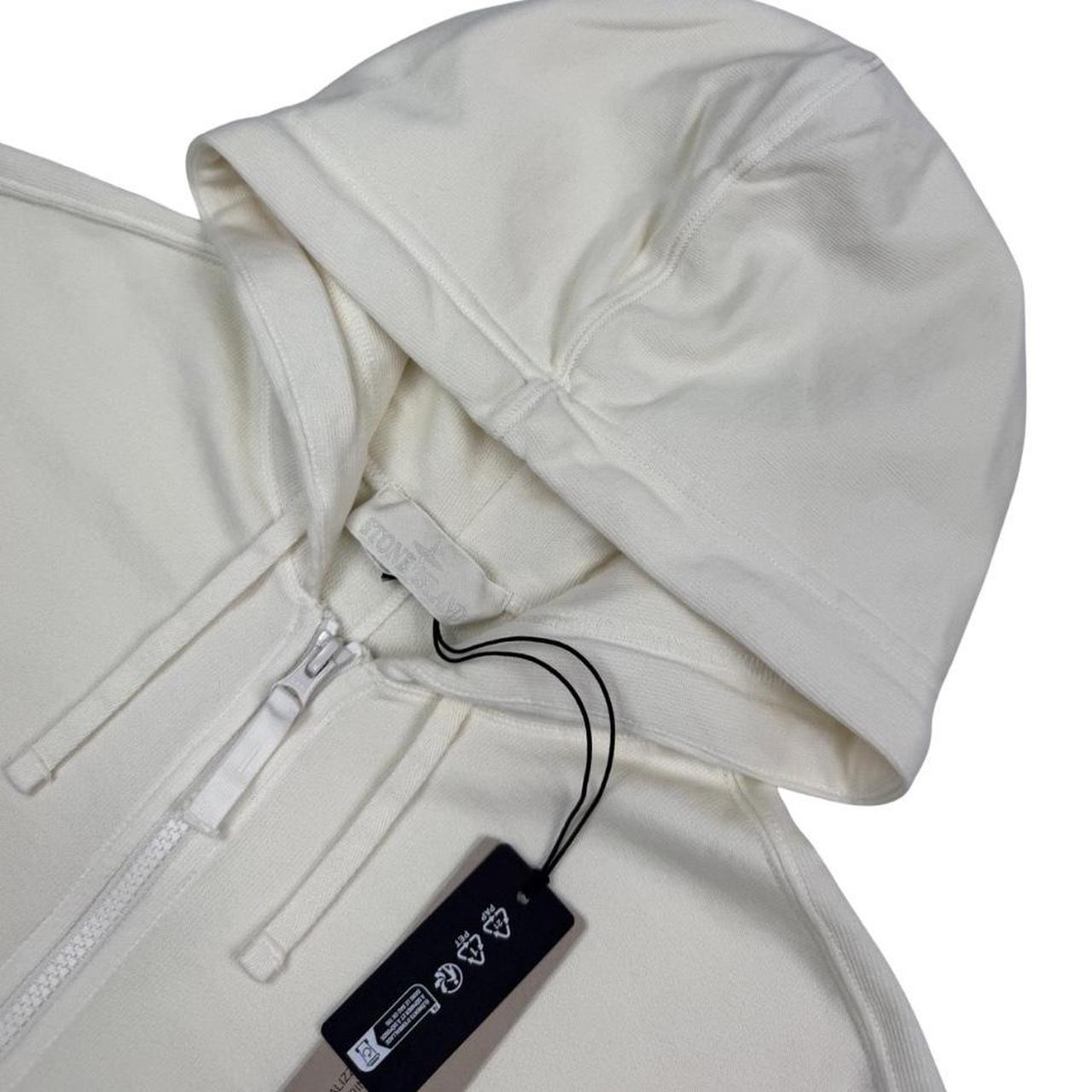 Stone Island cream full zip hoodie with ghost logo and cotton material.