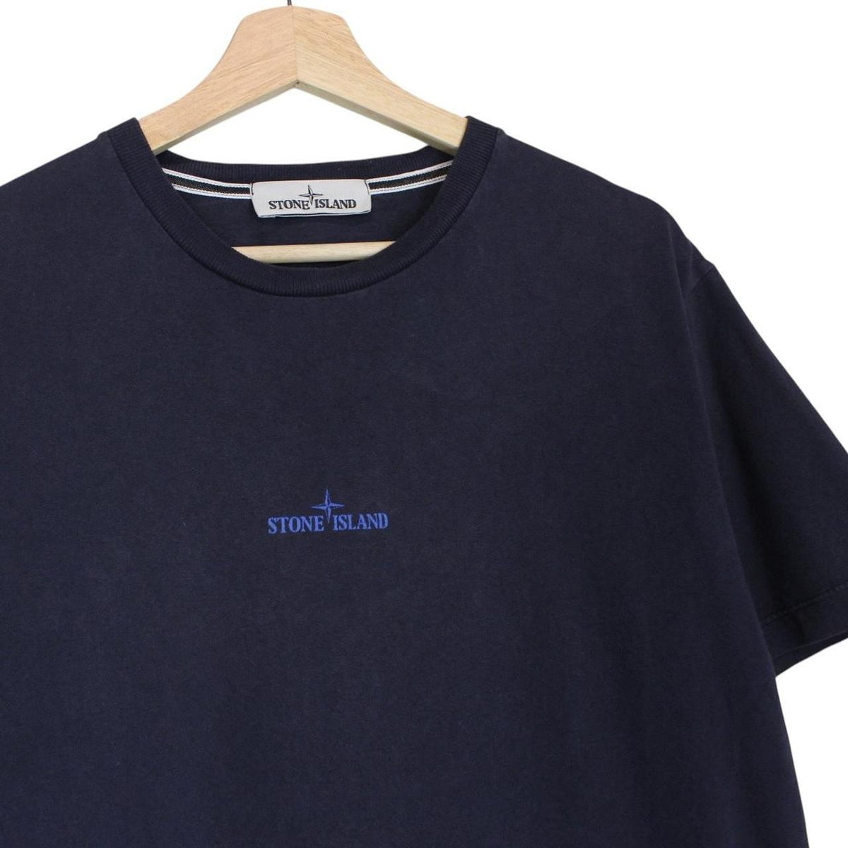Stone Island navy blue short sleeve cotton t-shirt with logo print and label detail.