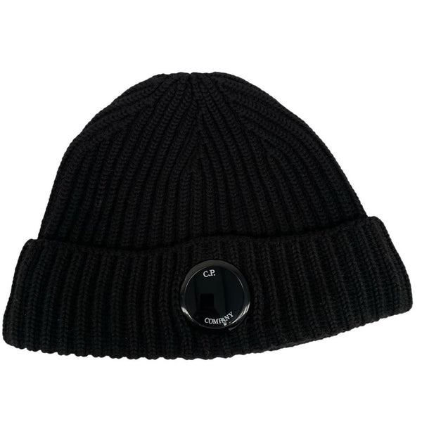 CP Company black wool knit beanie hat with signature lens detail.
