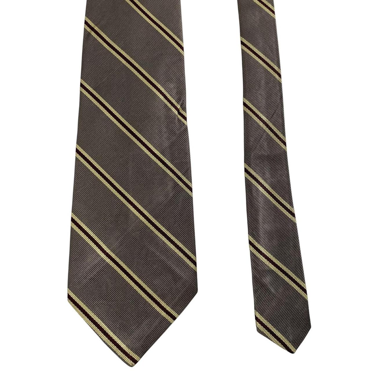 Polo Ralph Lauren grey silk tie with Neiman Marcus label and smooth texture.