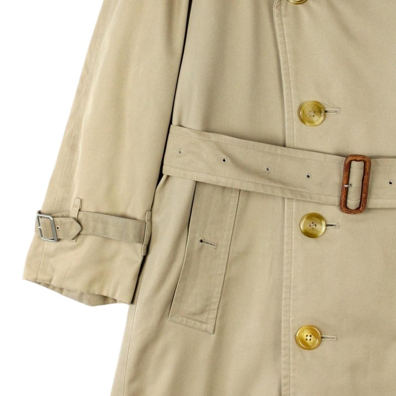 Burberry beige trench coat with Nova Check pattern, double-breasted and belted design.