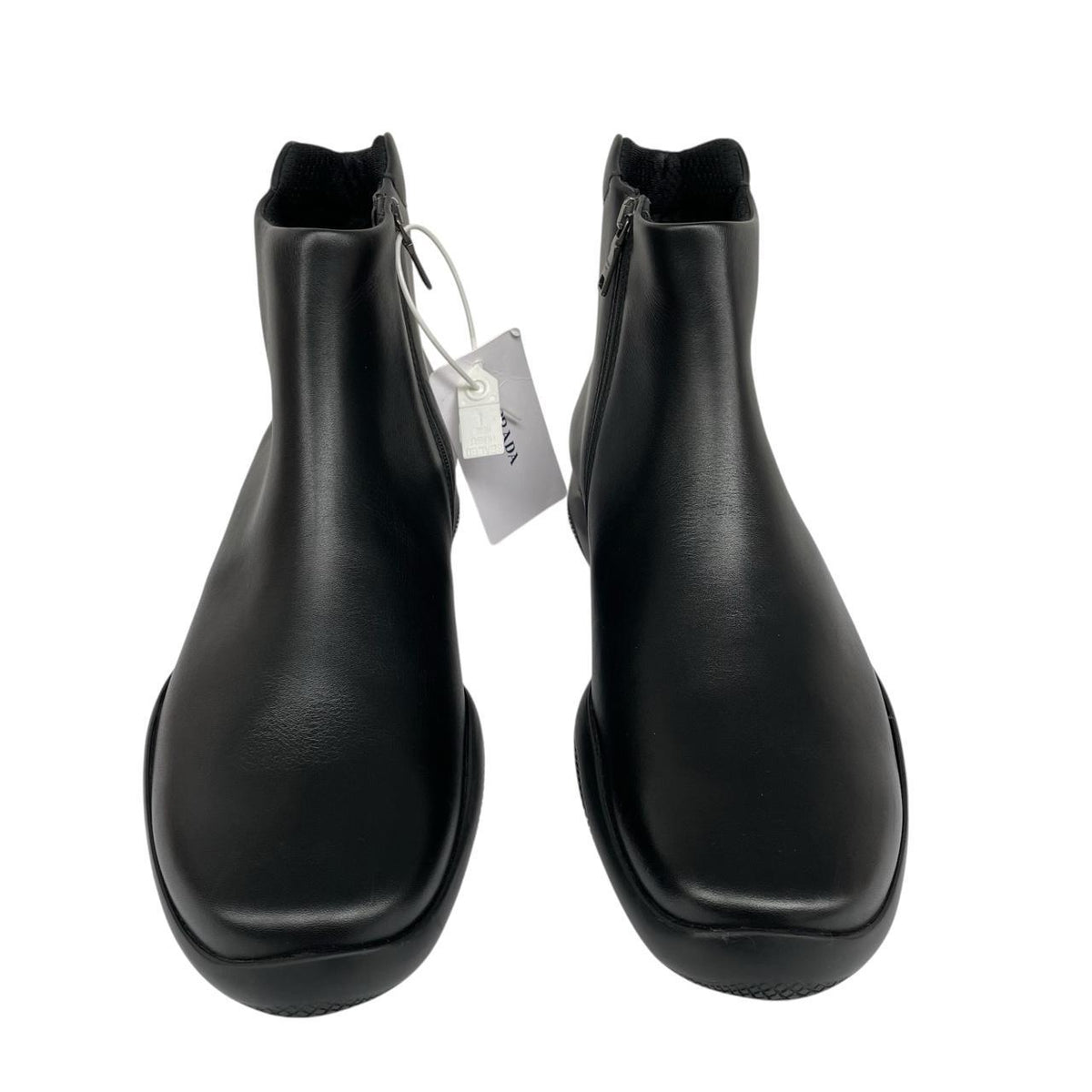 Prada black calfskin leather ankle boots with logo detail and original dust bags.