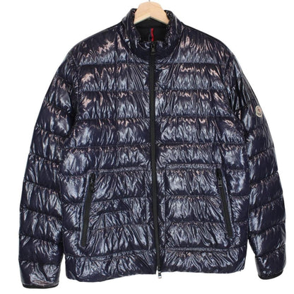 Moncler navy blue full zip down jacket with logo patch and quilted material.