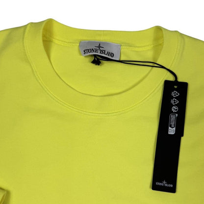 Stone Island yellow sweatshirt made from organic cotton with logo patch on sleeve.