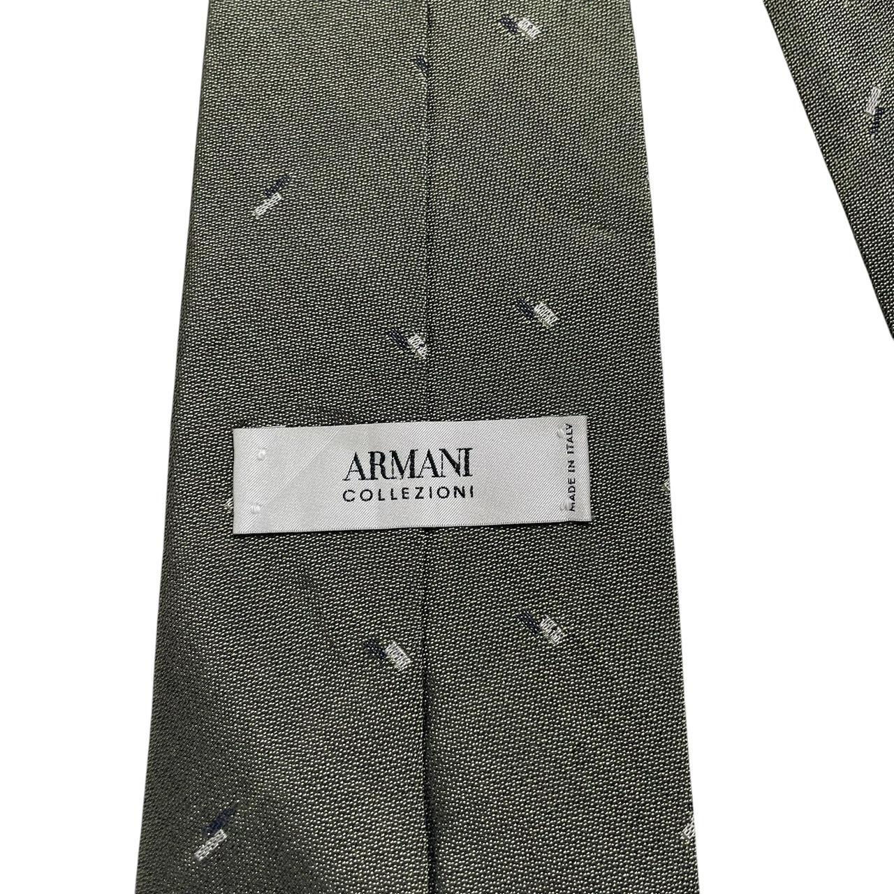 Armani vintage tie wool/polyester blend, dark pattern with subtle logo detail.