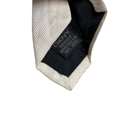 DKNY white silk tie with smooth texture and classic design.