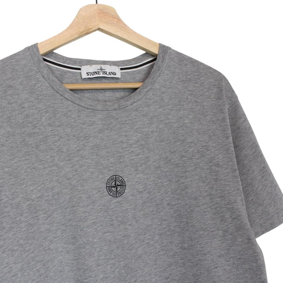 Stone Island grey short sleeve cotton t-shirt with logo print and visible stains.