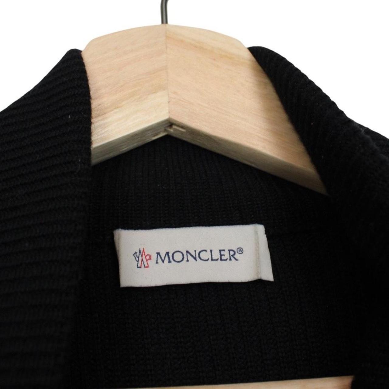 Moncler black cardigan jacket with full zip, wool/nylon blend, and logo detail.