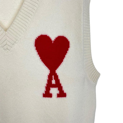 Ami Paris cream and red wool knit sweater vest with heart logo detail.