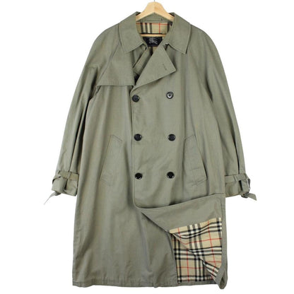 Burberry khaki green trench coat featuring Nova Check pattern and double-breasted design.