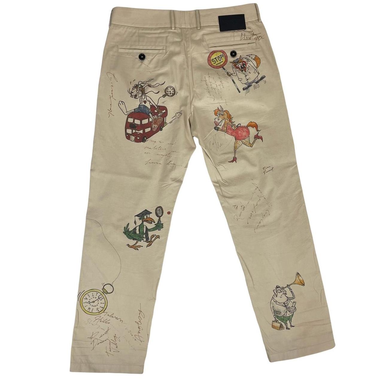 Burberry beige tapered fit trousers with sketch print design and cotton material.