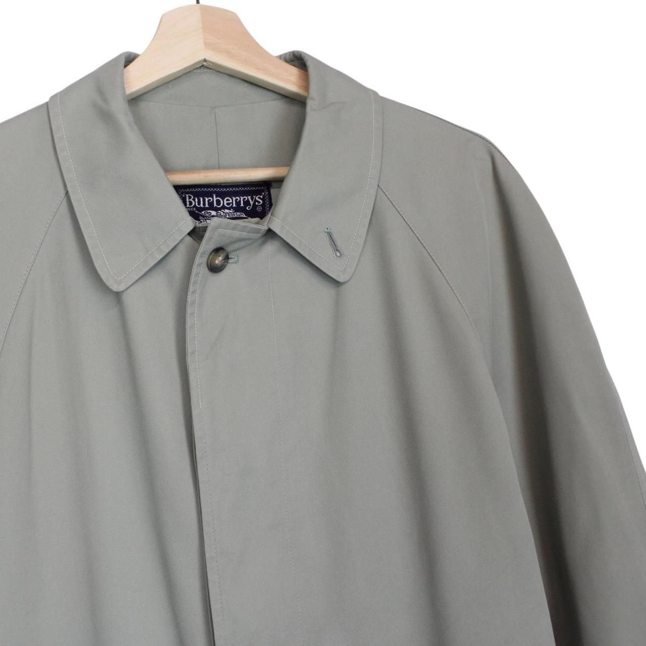 Burberry green trench coat with Nova Check pattern and single-breasted design.