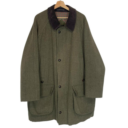 Barbour green tweed wool coat with classic pattern and missing front pocket button.