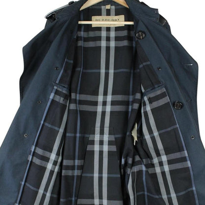 Burberry navy blue trench coat with Nova Check pattern and double-breasted design.