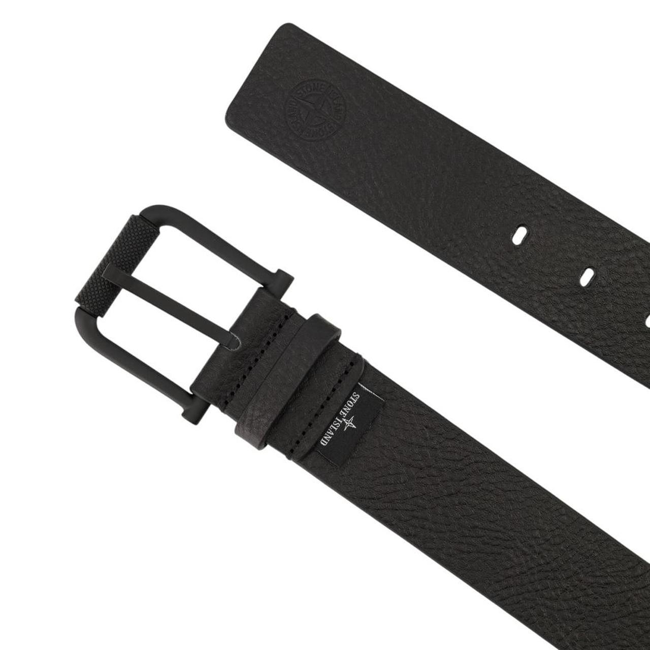 Stone Island black tumbled leather belt with debossed Compass logo and textured metal buckle.