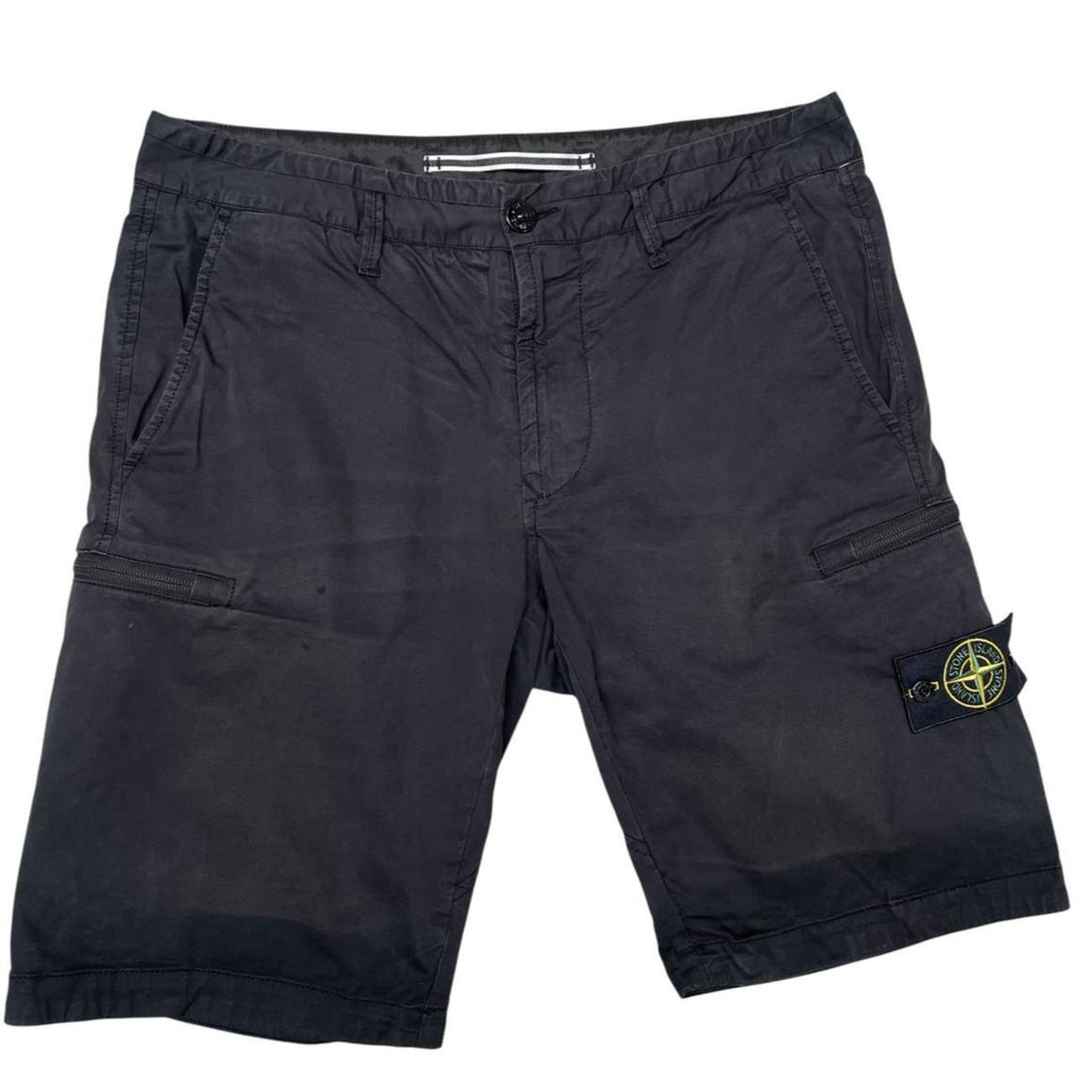 Stone Island navy blue cargo shorts with logo patch and faded cotton material.