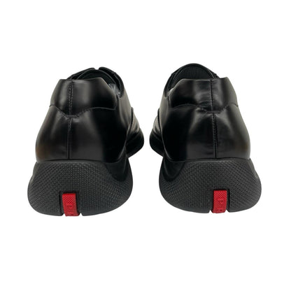 Prada black leather laced derby loafers with subtle signs of wear, includes original dust bags.