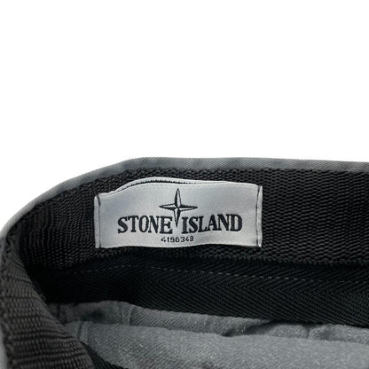 Stone Island grey slim fit cotton trousers with logo patch and classic design.
