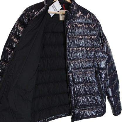 Moncler navy blue full zip down jacket with logo patch and quilted material.
