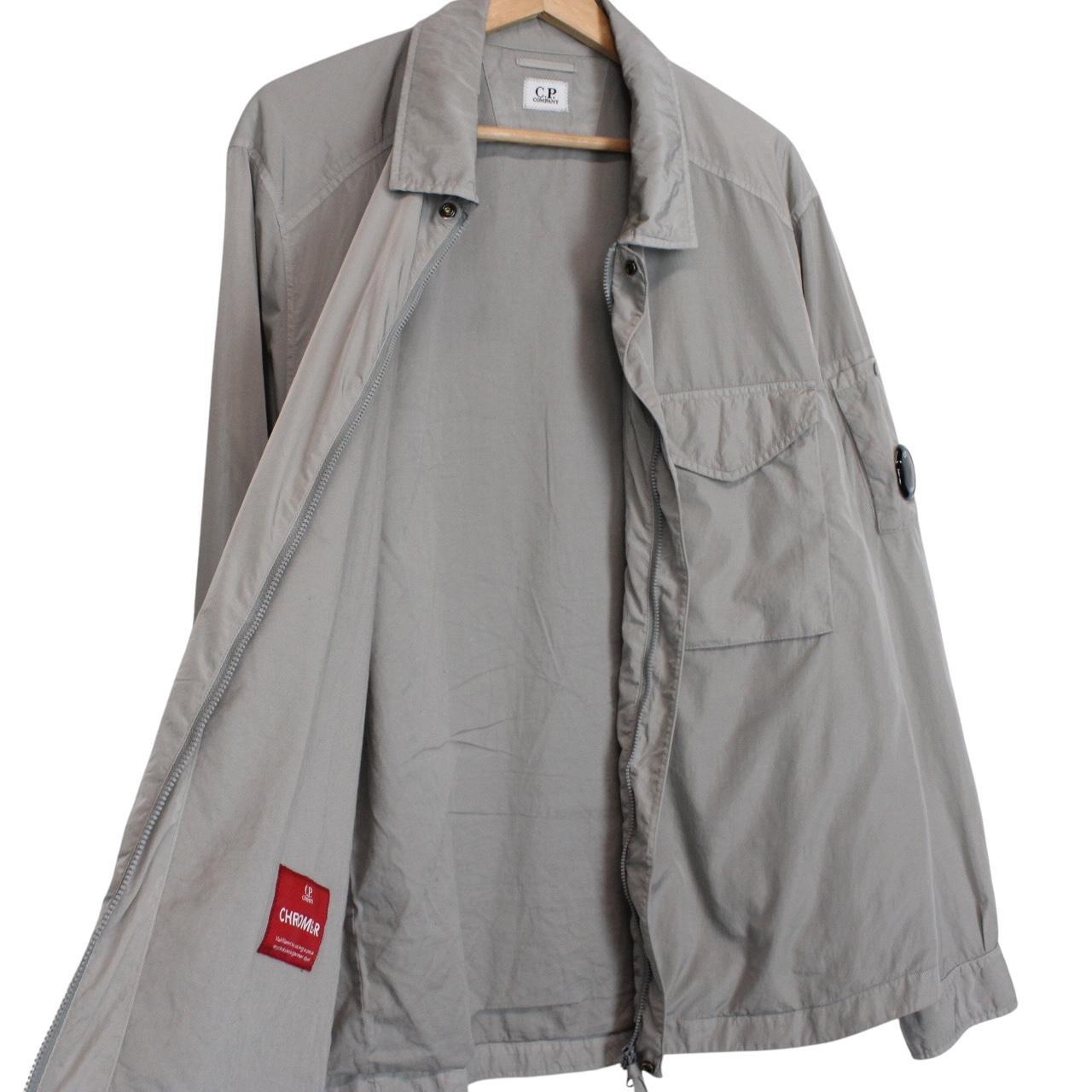 CP Company grey overshirt jacket with lens detail and garment dyed nylon fabric.