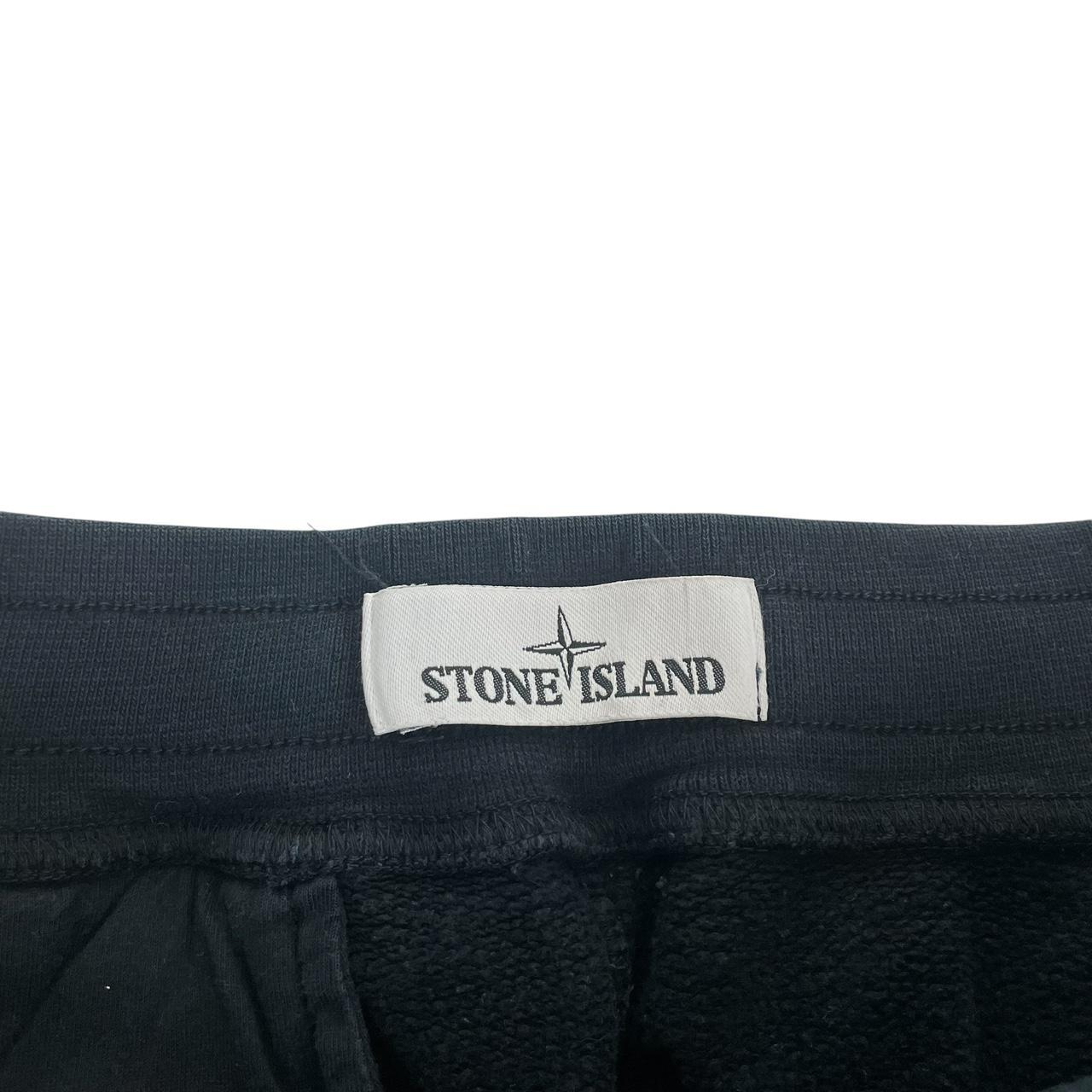 Stone Island navy blue joggers with logo patch and cotton material, pre-owned condition.