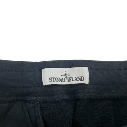 Stone Island navy blue joggers with logo patch and cotton material, pre-owned condition.