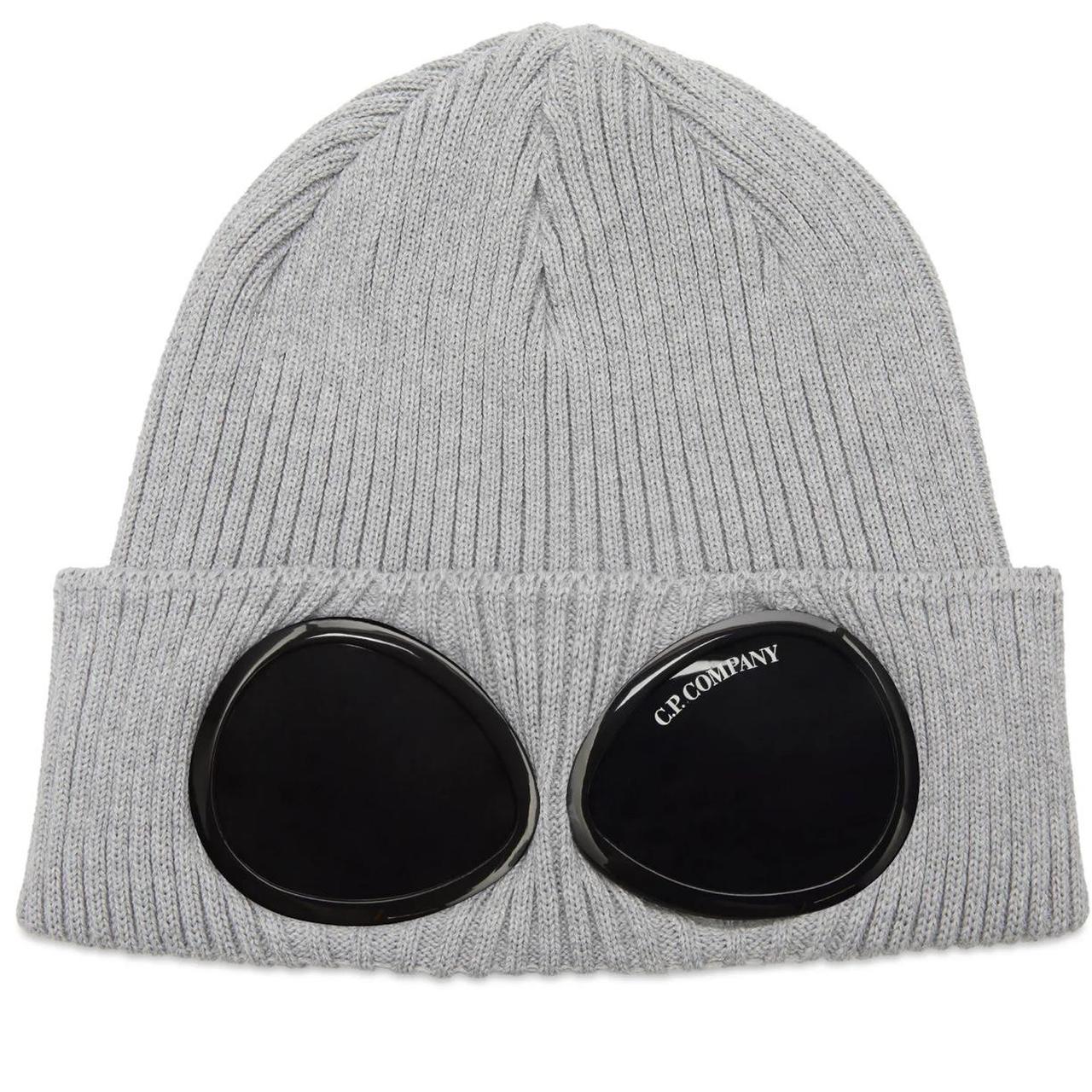 CP Company grey beanie hat with goggle detail and cotton material.