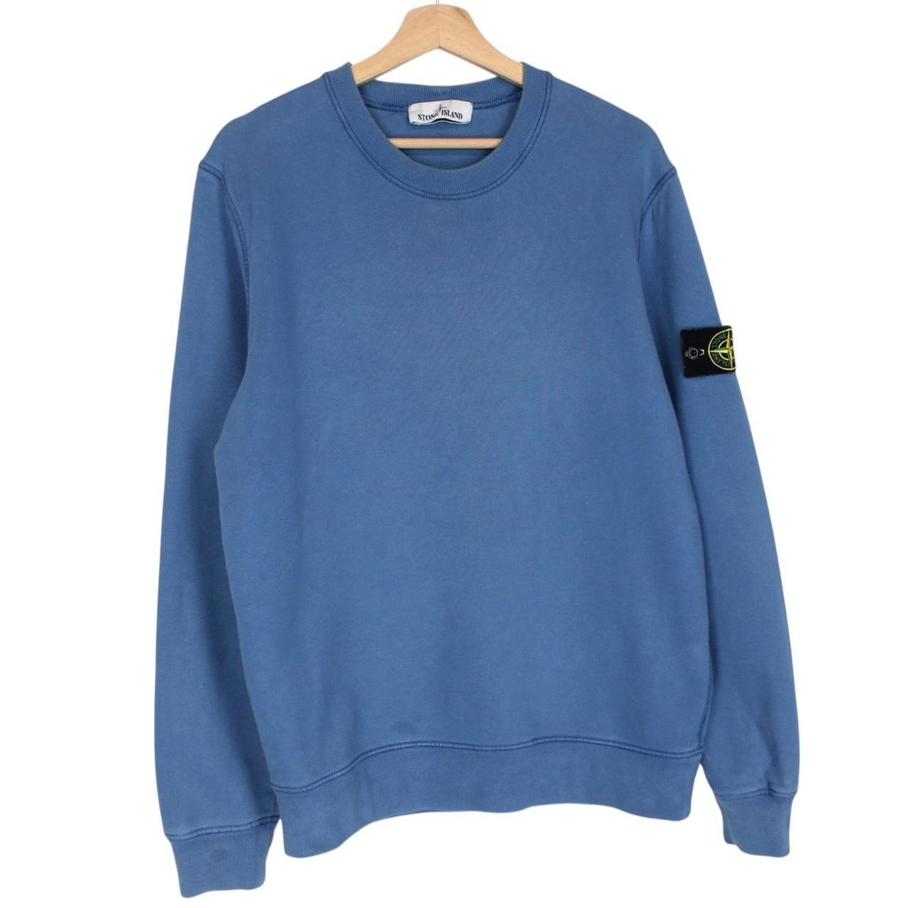 Stone Island blue cotton sweatshirt with embroidered logo and slight wear marks.