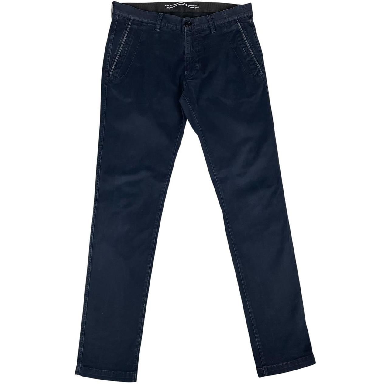 Stone Island navy blue slim fit cotton trousers with logo patch and clean design.