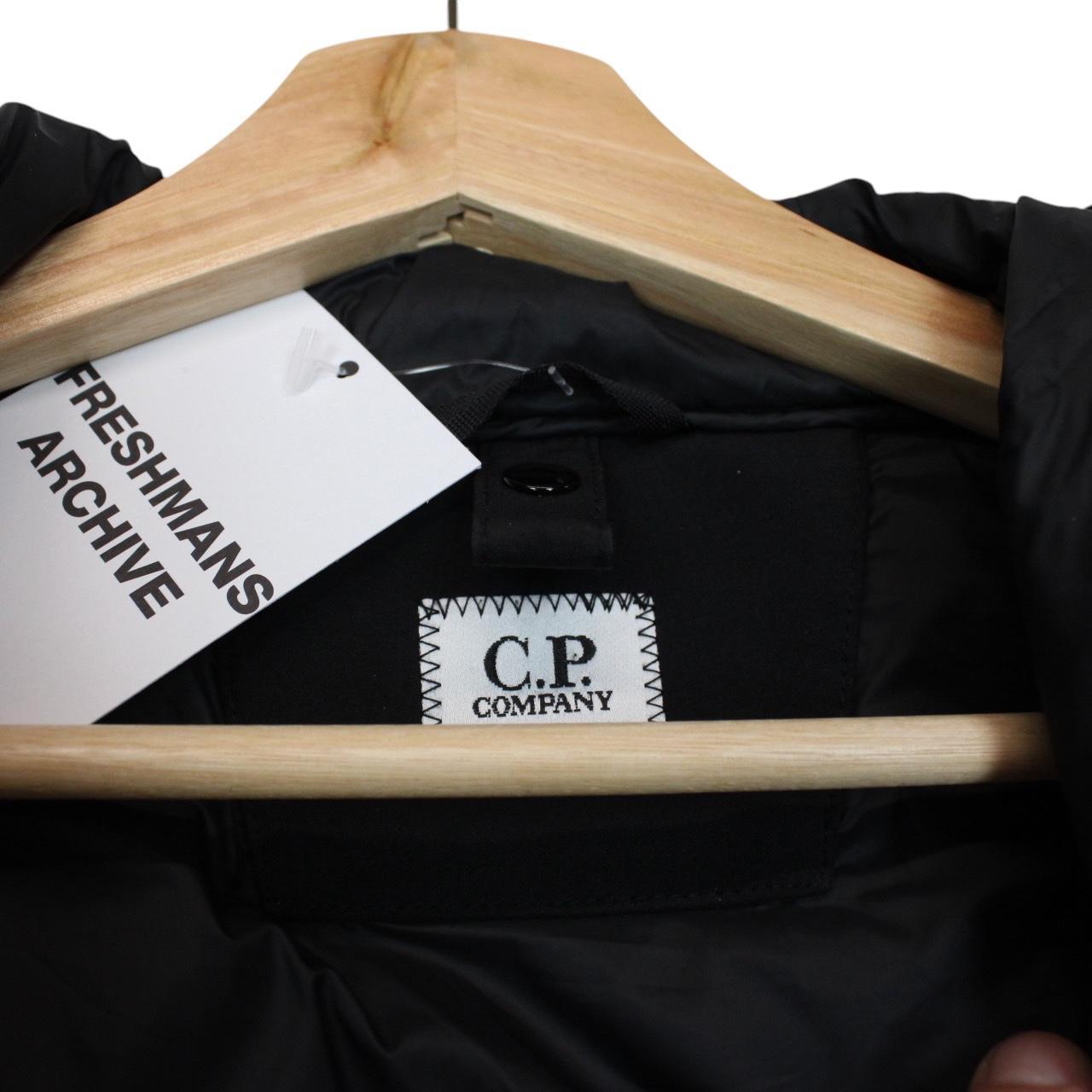 CP Company black goggle gilet with logo detail and shell material.