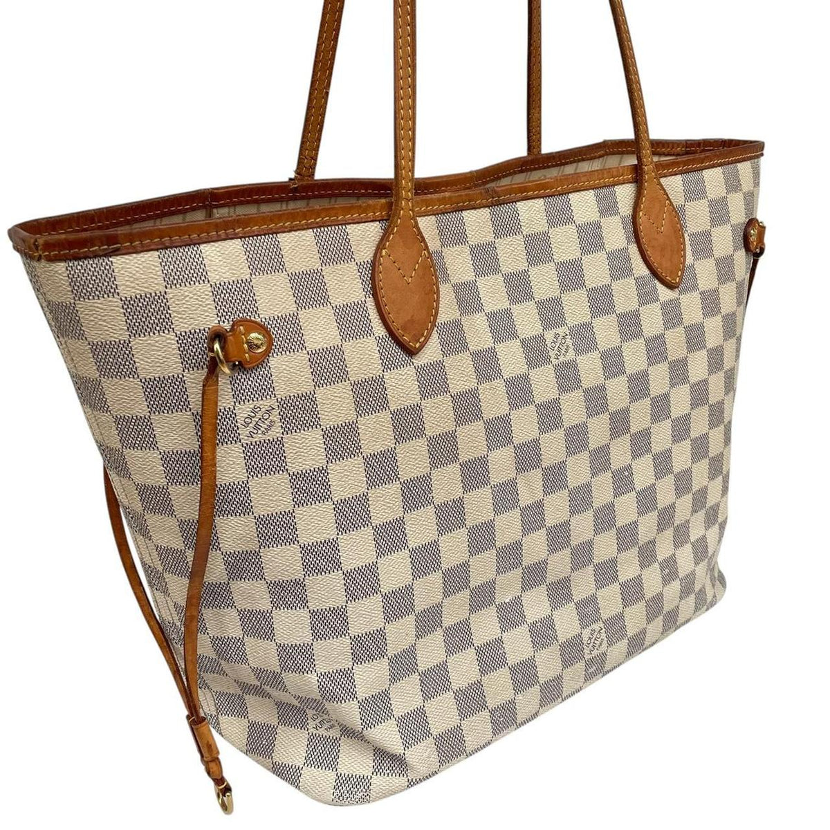 Louis Vuitton cream Damier Azur tote bag with leather trim and logo pattern.