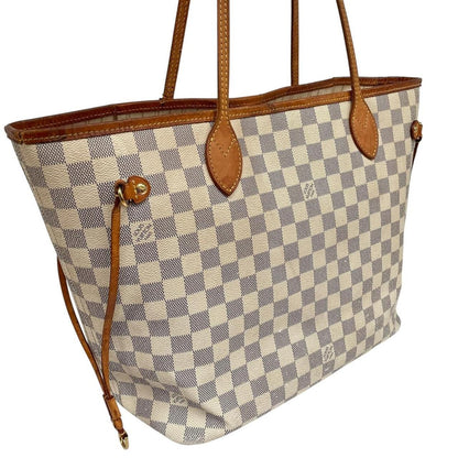 Louis Vuitton cream Damier Azur tote bag with leather trim and logo pattern.