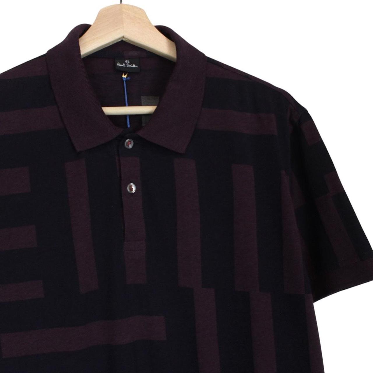 Paul Smith burgundy polo shirt with short sleeves, cotton material, brand logo on collar.
