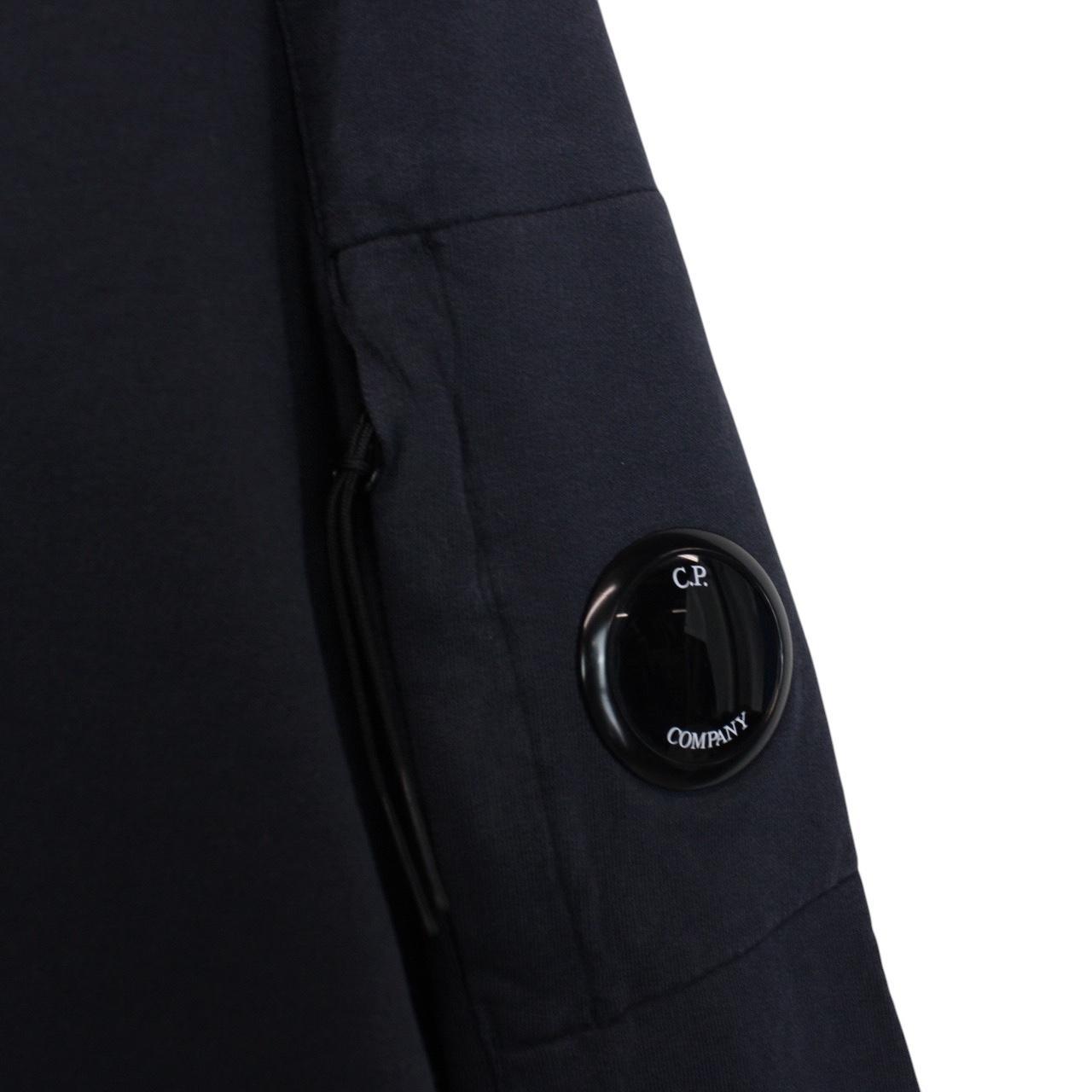 CP Company navy blue cotton sweatshirt with goggle lens detail and logo.