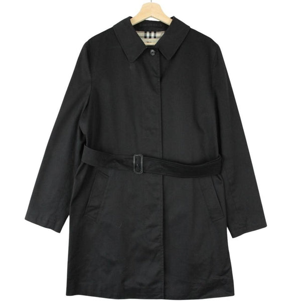 Burberry black trench coat with Nova Check pattern and belted waist in cotton.