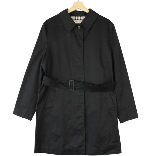 Burberry black trench coat with Nova Check pattern and belted waist in cotton.