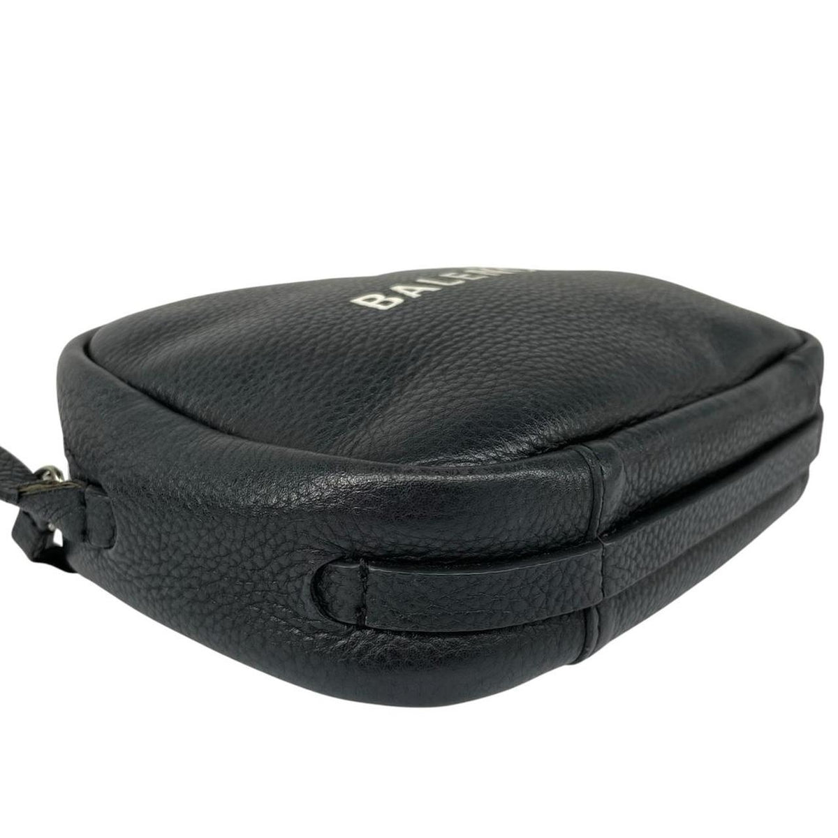 Balenciaga black leather messenger bag with embossed logo and minimalistic design.