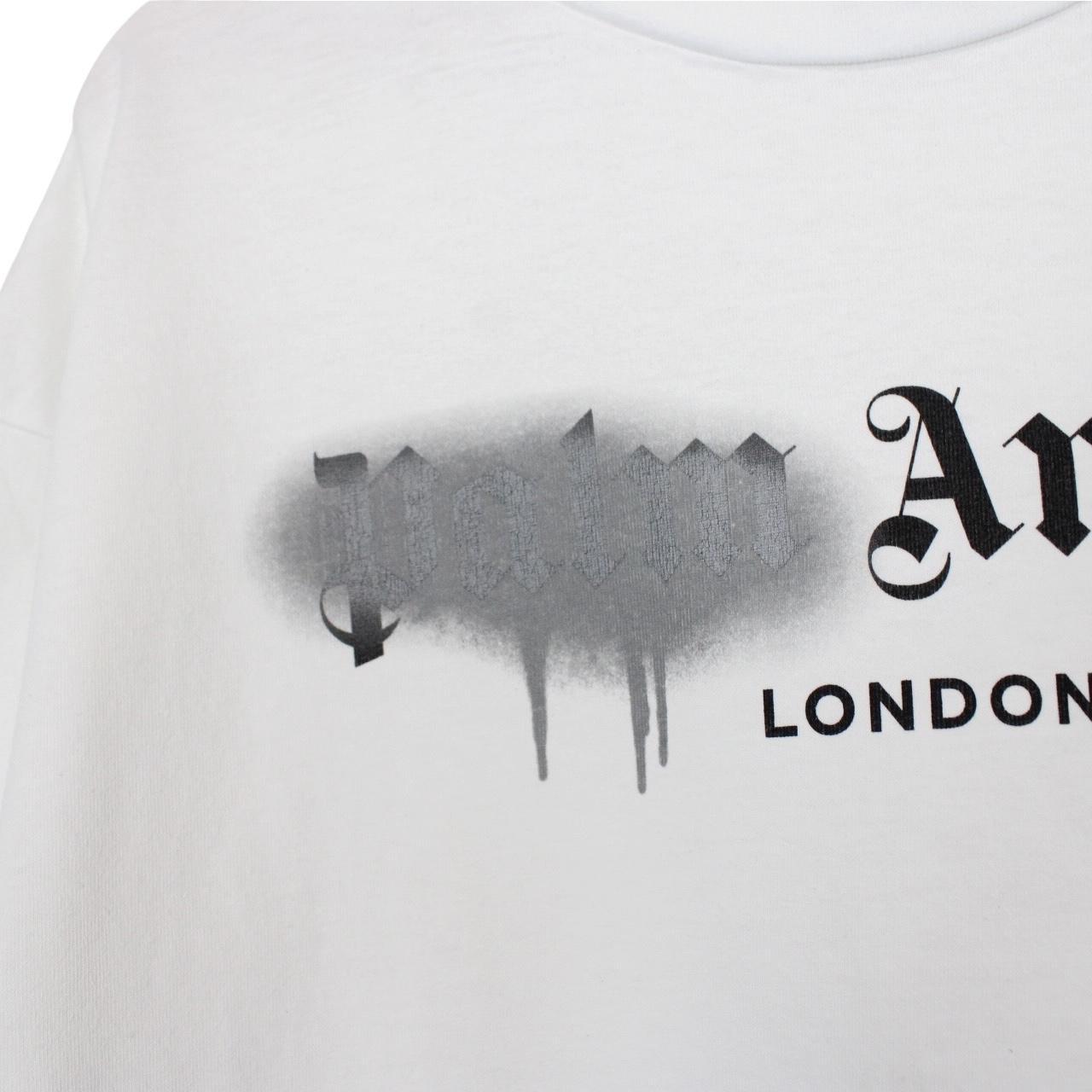 Palm Angels white cotton t-shirt with sprayed print and chest pocket detail.