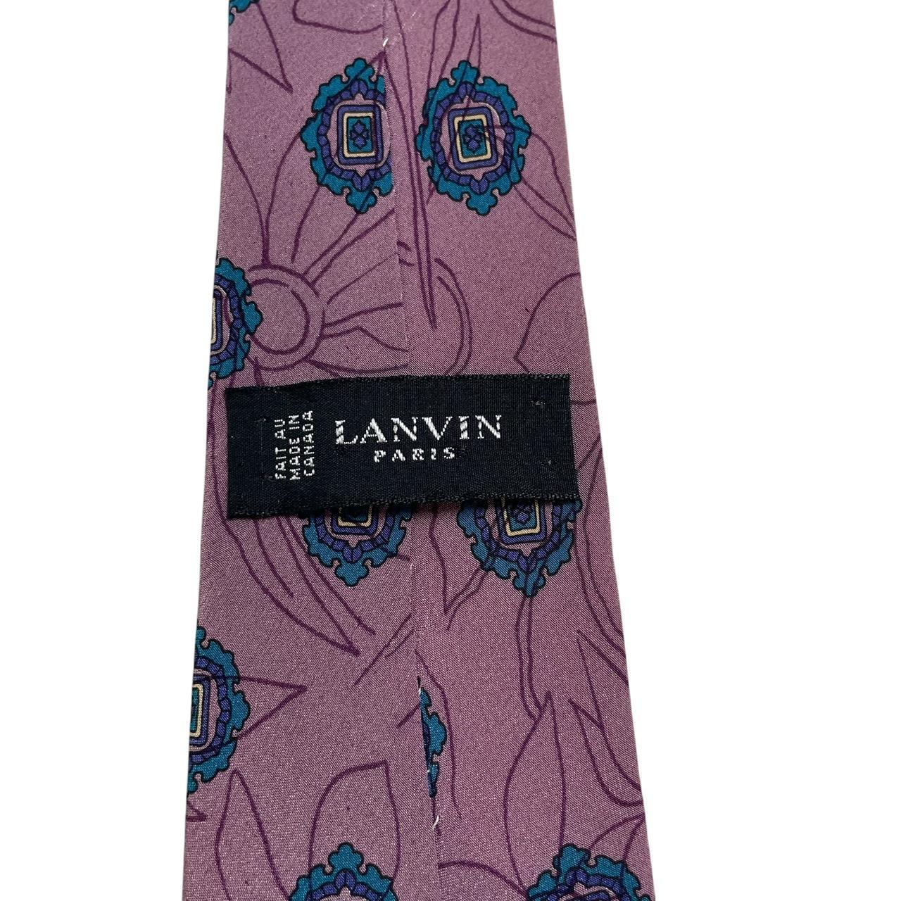 Lanvin cream silk tie with floral pattern and logo detail.